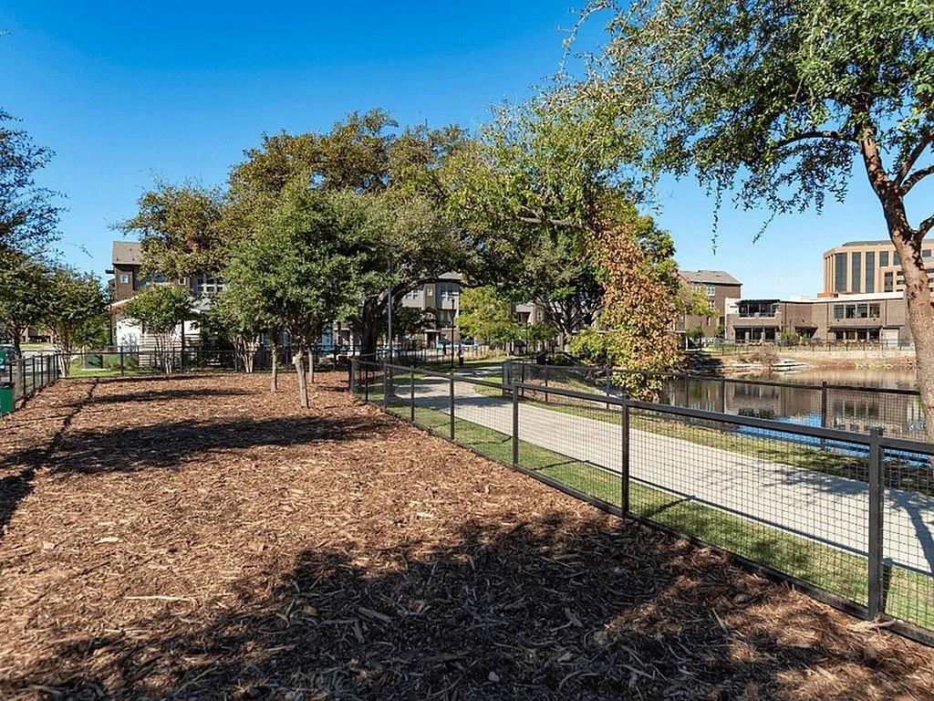 4020 McEwen Road, Unit 3103 Farmers Branch, TX 75244 - Photo 26 of 27 a view of a yard with wooden fence