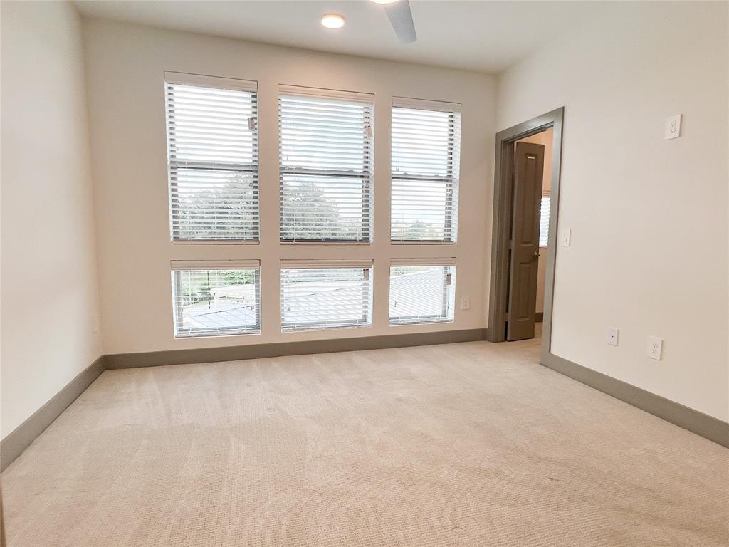 4020 McEwen Road, Unit 3103 Farmers Branch, TX 75244 - Photo 5 of 27 an empty room with windows