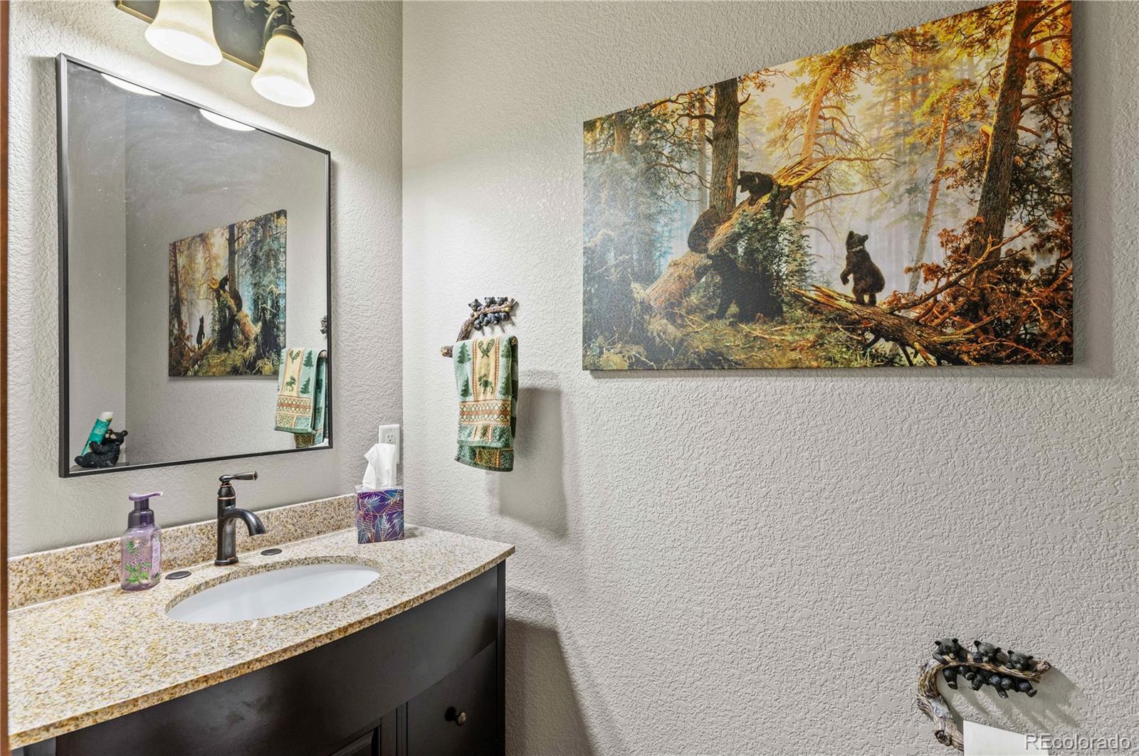 1310 Sunrise Ridge Cotopaxi, CO 81223 - Photo 34 of 50 a bathroom with a granite countertop sink mirror and vanity