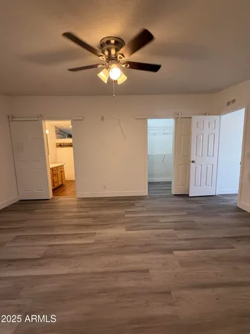a kitchen with sink refrigerator and microwave