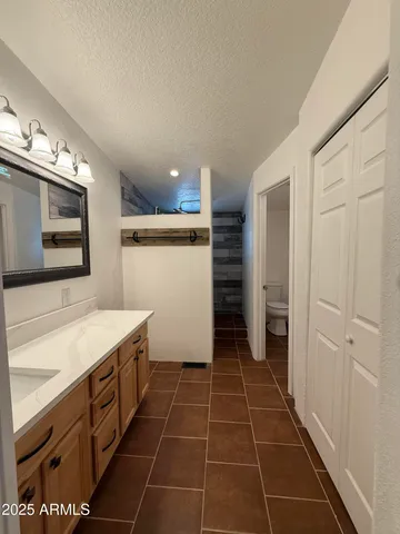 a kitchen with stainless steel appliances and wooden cabinets
