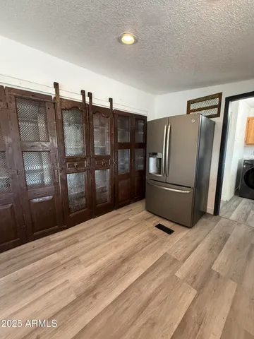 a view of a lake with houses in the back