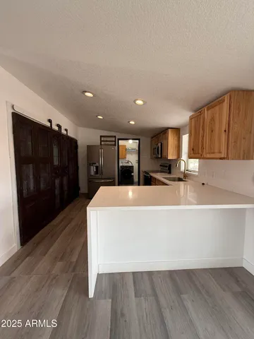 a view of a lake with houses in the back