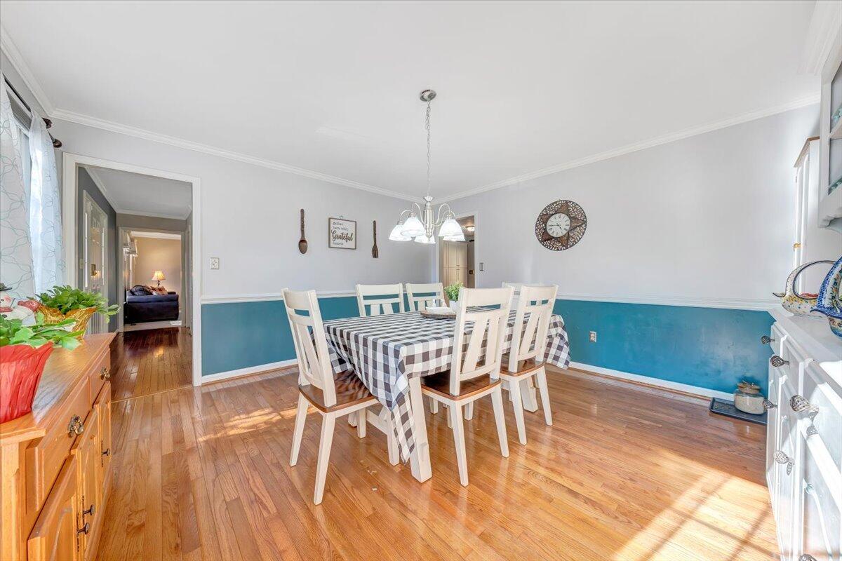 6128 Buckland Mill Road Roanoke, VA 24019 - Photo 18 of 37 a view of a dining room with furniture window and wooden floor
