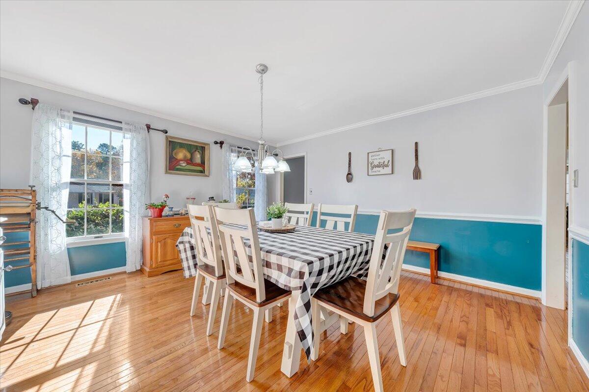 6128 Buckland Mill Road Roanoke, VA 24019 - Photo 19 of 37 a view of a dining room with furniture window and wooden floor