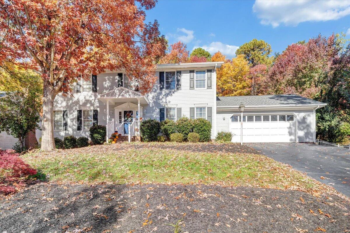 6128 Buckland Mill Road Roanoke, VA 24019 - Photo 3 of 37 a front view of a house with a yard and garage