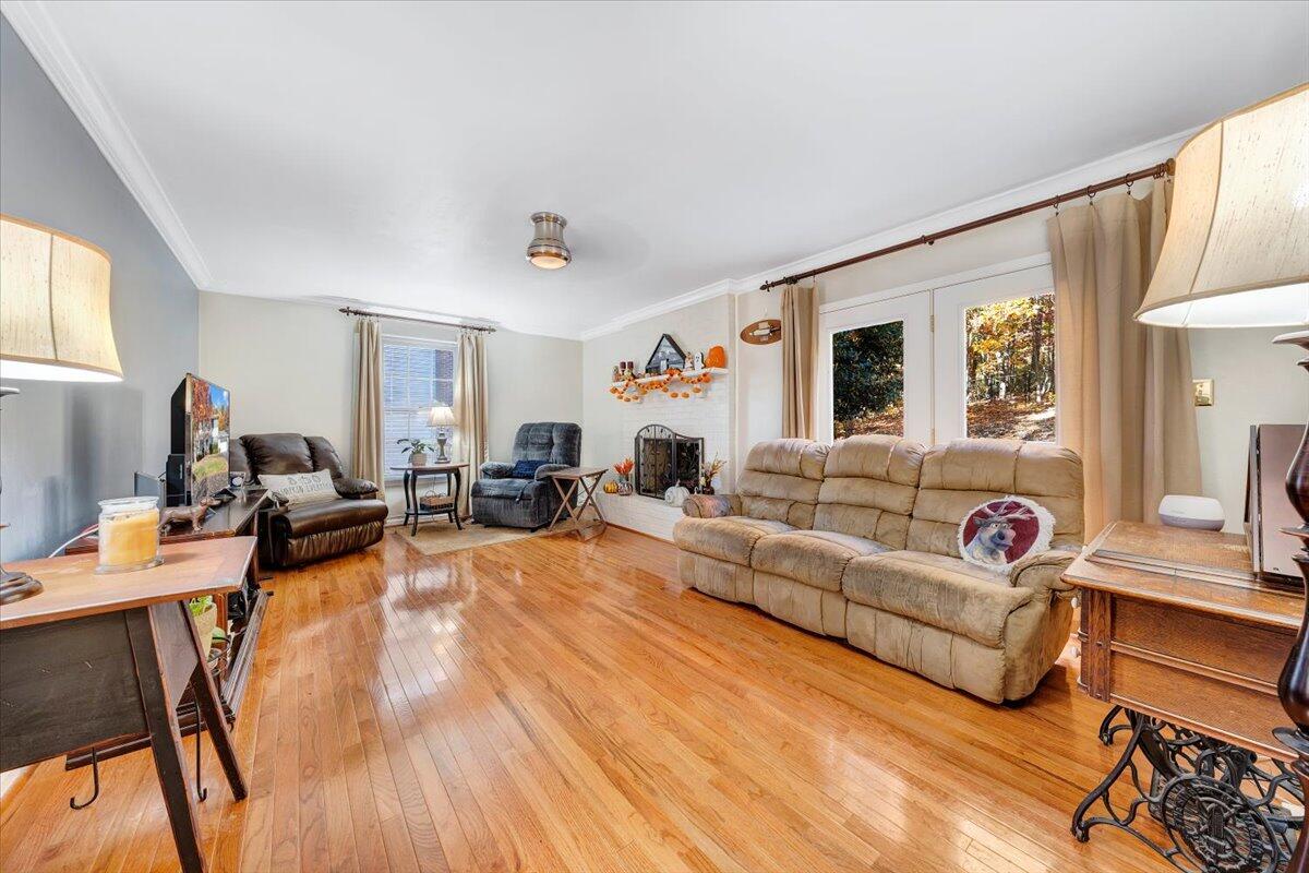 6128 Buckland Mill Road Roanoke, VA 24019 - Photo 22 of 37 a living room with furniture fireplace and a window