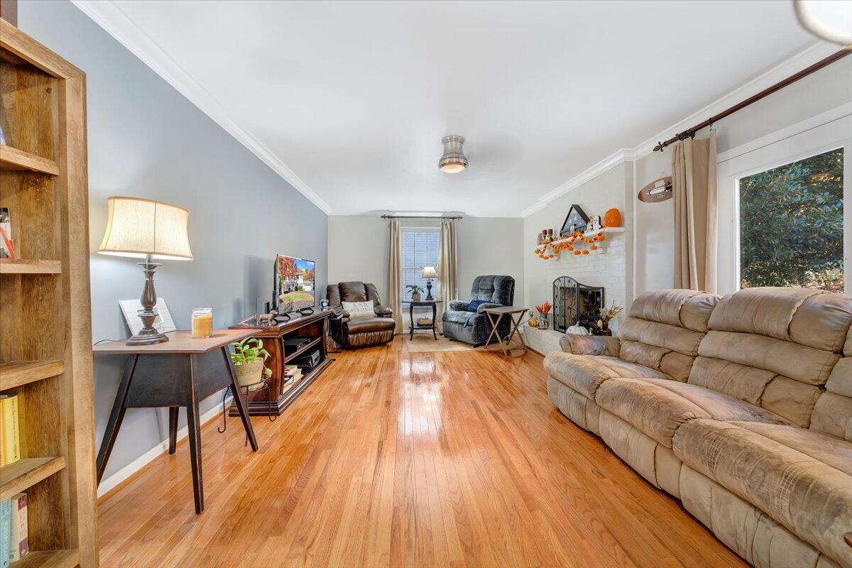 6128 Buckland Mill Road Roanoke, VA 24019 - Photo 23 of 37 a living room with furniture and a wooden floor