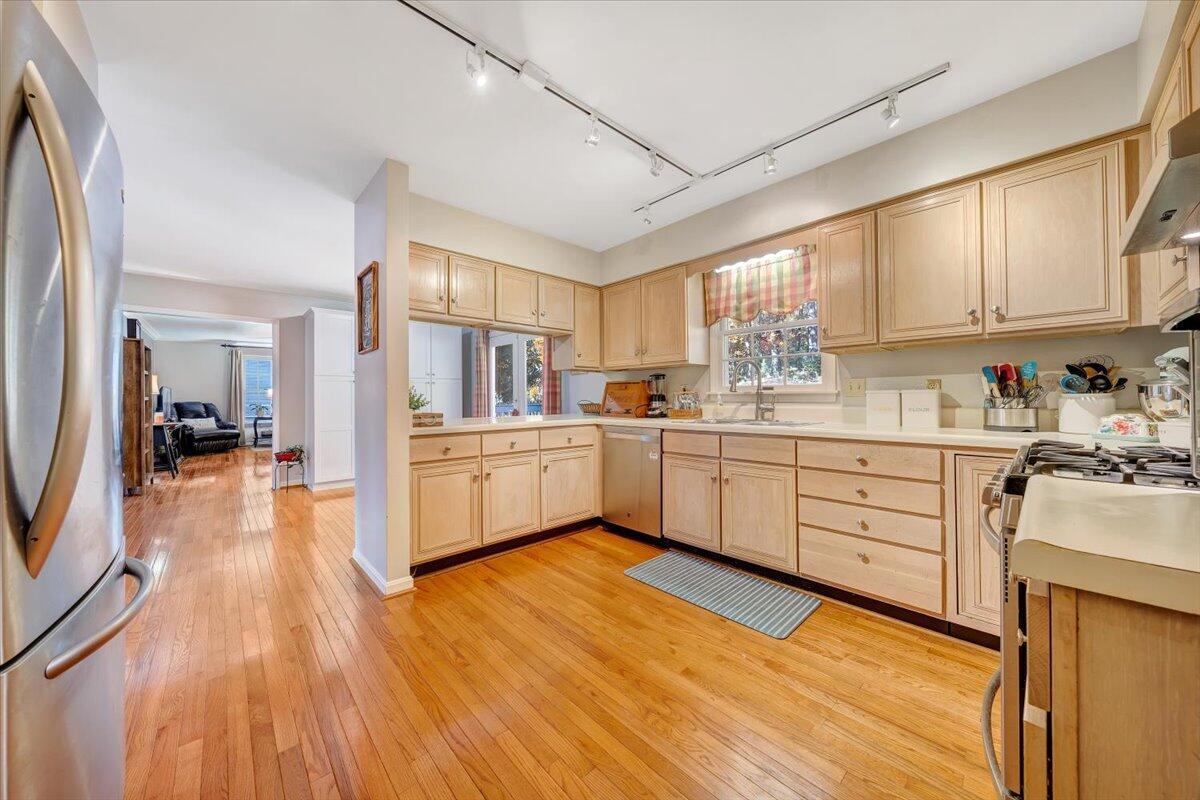 6128 Buckland Mill Road Roanoke, VA 24019 - Photo 27 of 37 a kitchen with white cabinets sink and white appliances