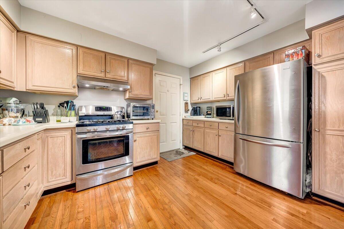 6128 Buckland Mill Road Roanoke, VA 24019 - Photo 28 of 37 a kitchen with stainless steel appliances a refrigerator sink and cabinets
