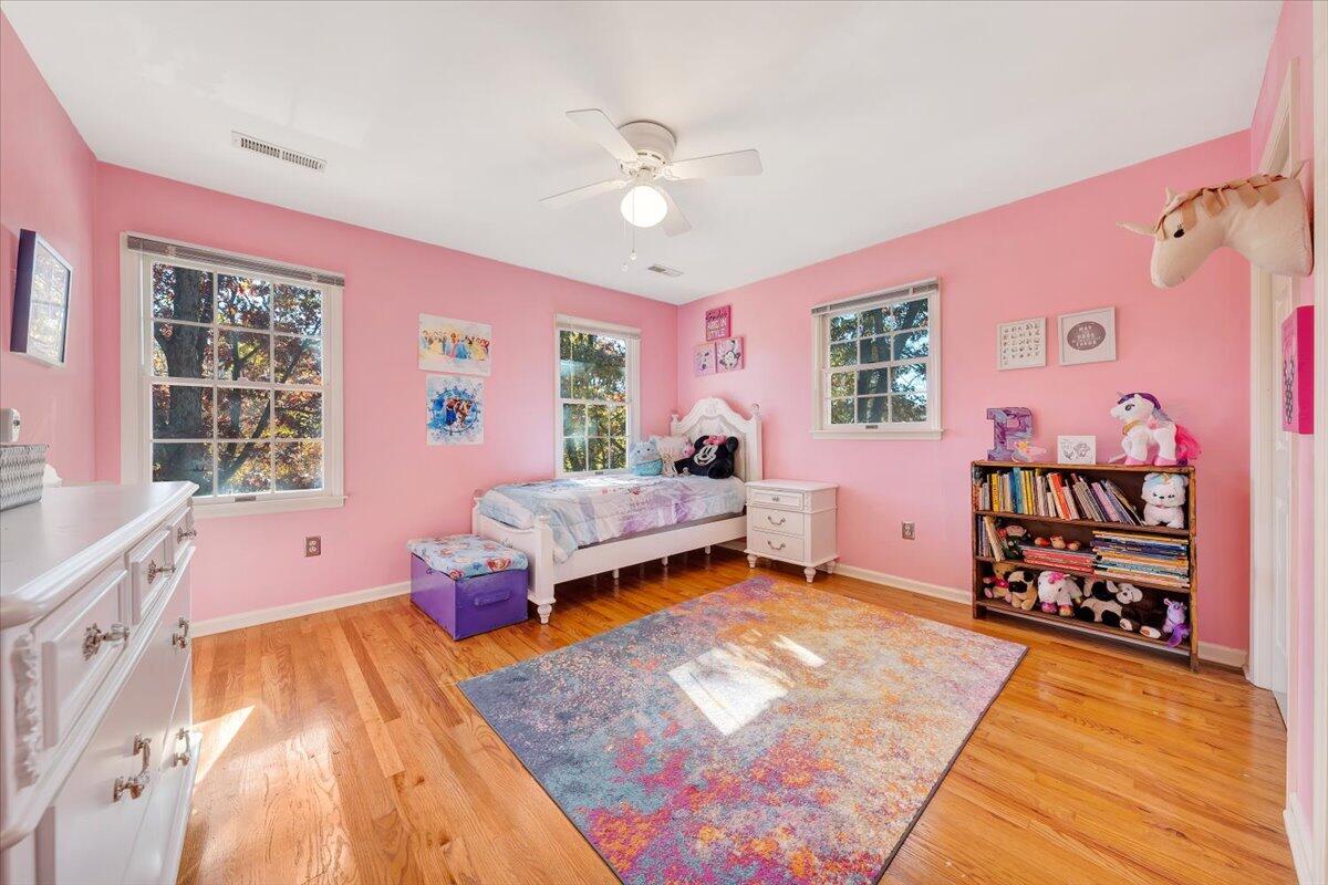 6128 Buckland Mill Road Roanoke, VA 24019 - Photo 29 of 37 a bedroom with a bed and a chandelier