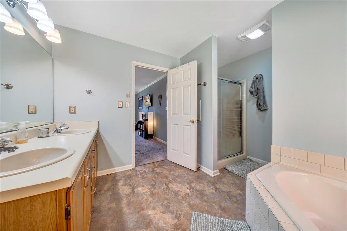6128 Buckland Mill Road Roanoke, VA 24019 - Photo 35 of 37 a bathroom with a sink a toilet and shower
