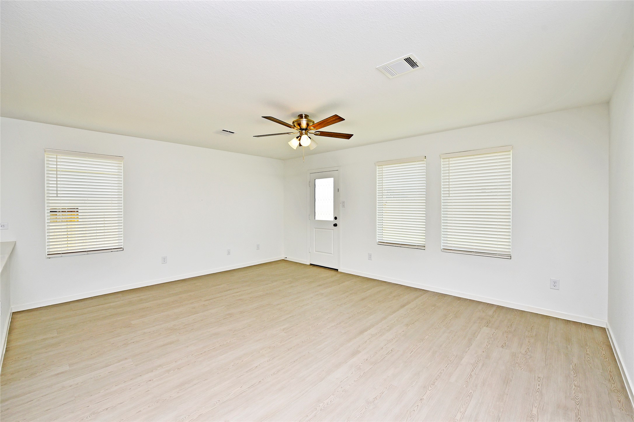 10218 Prairie Dunes Lane Cleveland, TX 77327 - Photo 6 of 32 a view of an empty room with a window