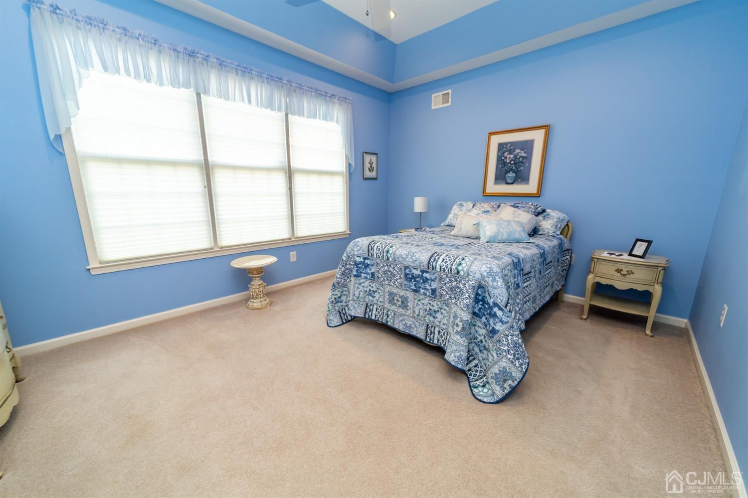 15 Stryker Road Somerset, NJ 08873 - Photo 13 of 24 a bed sitting in a bedroom next to a window