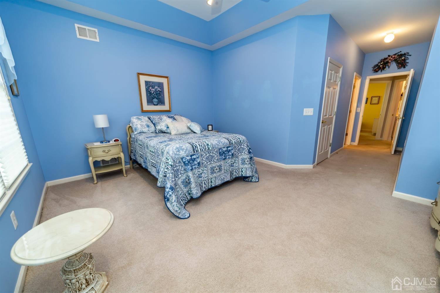 15 Stryker Road Somerset, NJ 08873 - Photo 15 of 24 a room with a bed and a lamp
