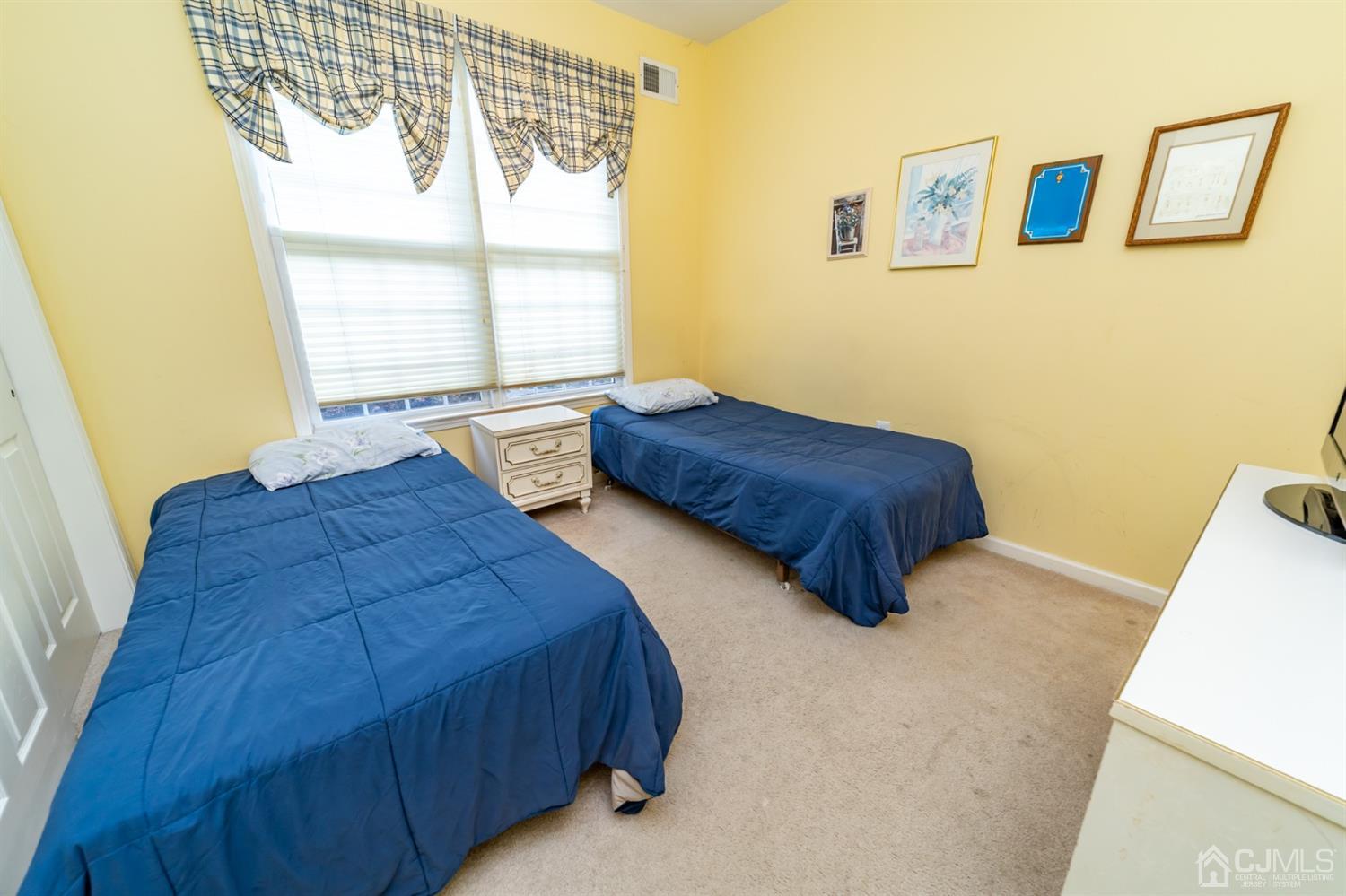 15 Stryker Road Somerset, NJ 08873 - Photo 17 of 24 a bedroom with two beds and a window
