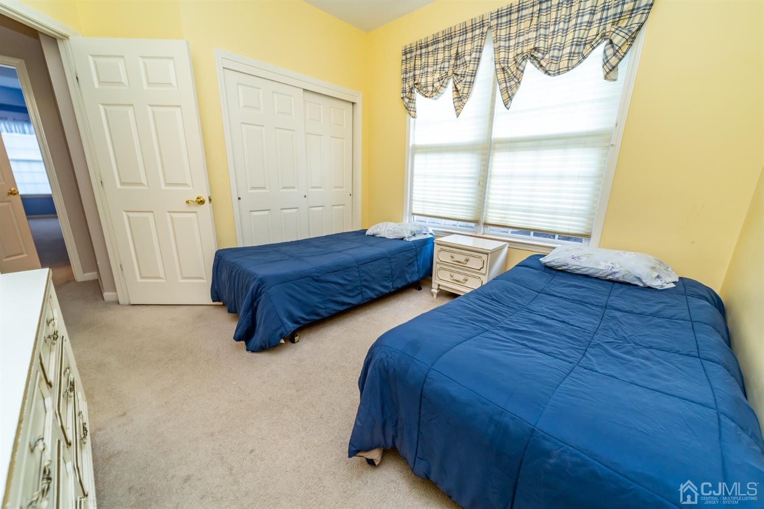 15 Stryker Road Somerset, NJ 08873 - Photo 18 of 24 a spacious bedroom with two beds and a window