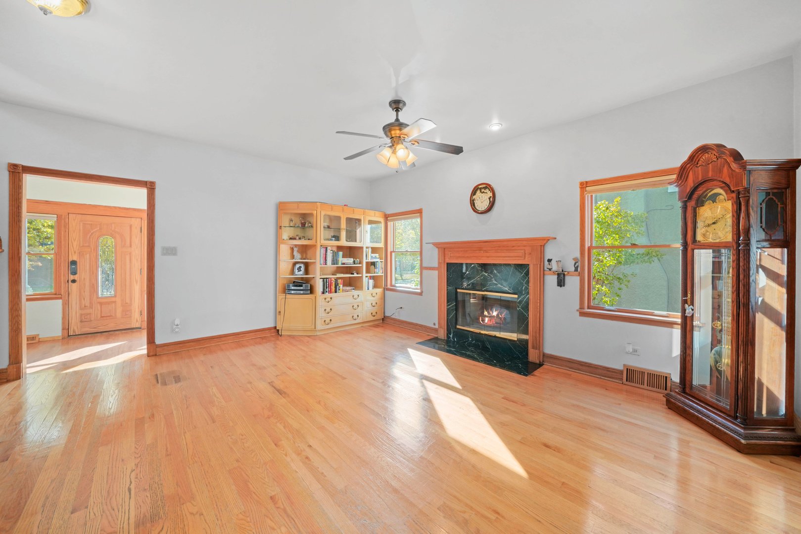 296 Addison Road Riverside, IL 60546 - Photo 6 of 34 a view of an empty room with window and fireplace