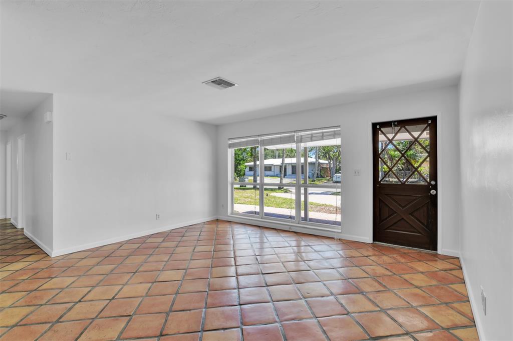 341 Southeast 8th Street Pompano Beach, FL 33060 - Photo 15 of 56 a view of an empty room and window
