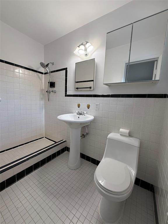 341 Southeast 8th Street Pompano Beach, FL 33060 - Photo 19 of 56 a bathroom with a toilet sink and mirror