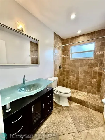 a spacious bedroom with a bed and furniture