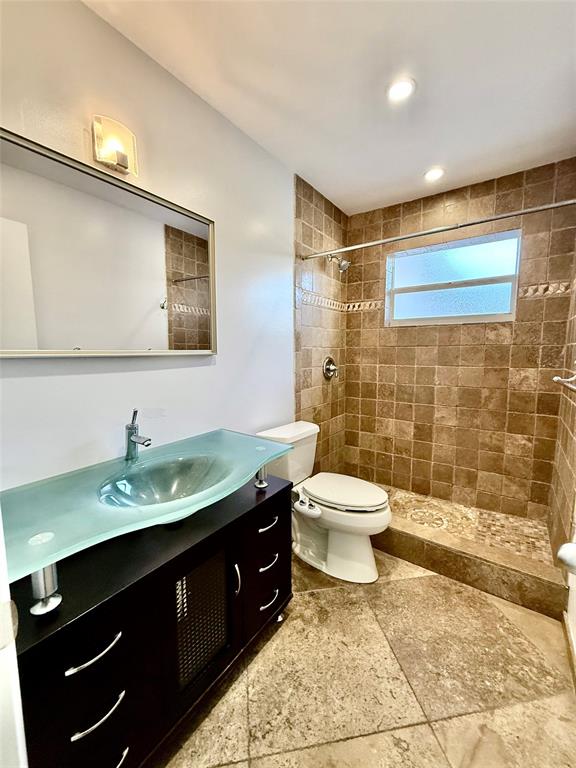 341 Southeast 8th Street Pompano Beach, FL 33060 - Photo 23 of 56 a bathroom with a sink toilet and shower