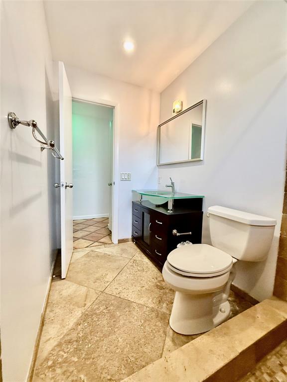 341 Southeast 8th Street Pompano Beach, FL 33060 - Photo 24 of 56 a bathroom with a sink toilet and shower