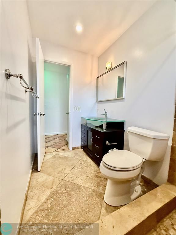 341 Southeast 8th Street Pompano Beach, FL 33060 - Photo 24 of 56 a bathroom with a sink toilet and shower