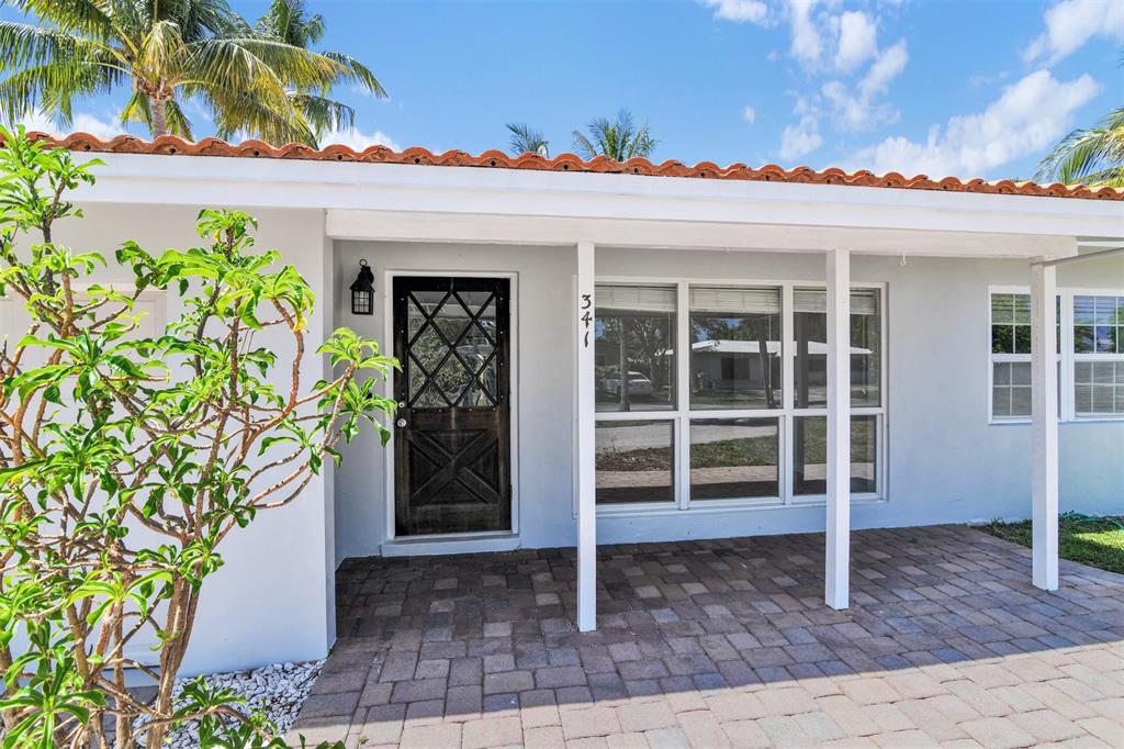 341 Southeast 8th Street Pompano Beach, FL 33060 - Photo 30 of 56 a front view of a house