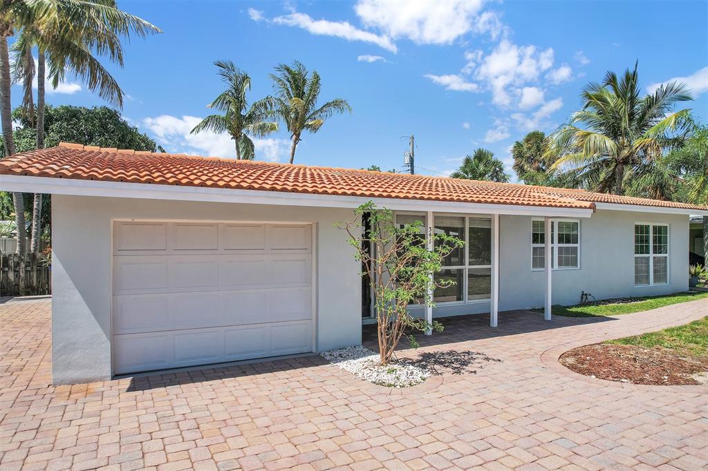 341 Southeast 8th Street Pompano Beach, FL 33060 - Photo 31 of 56 a view of a house with a patio