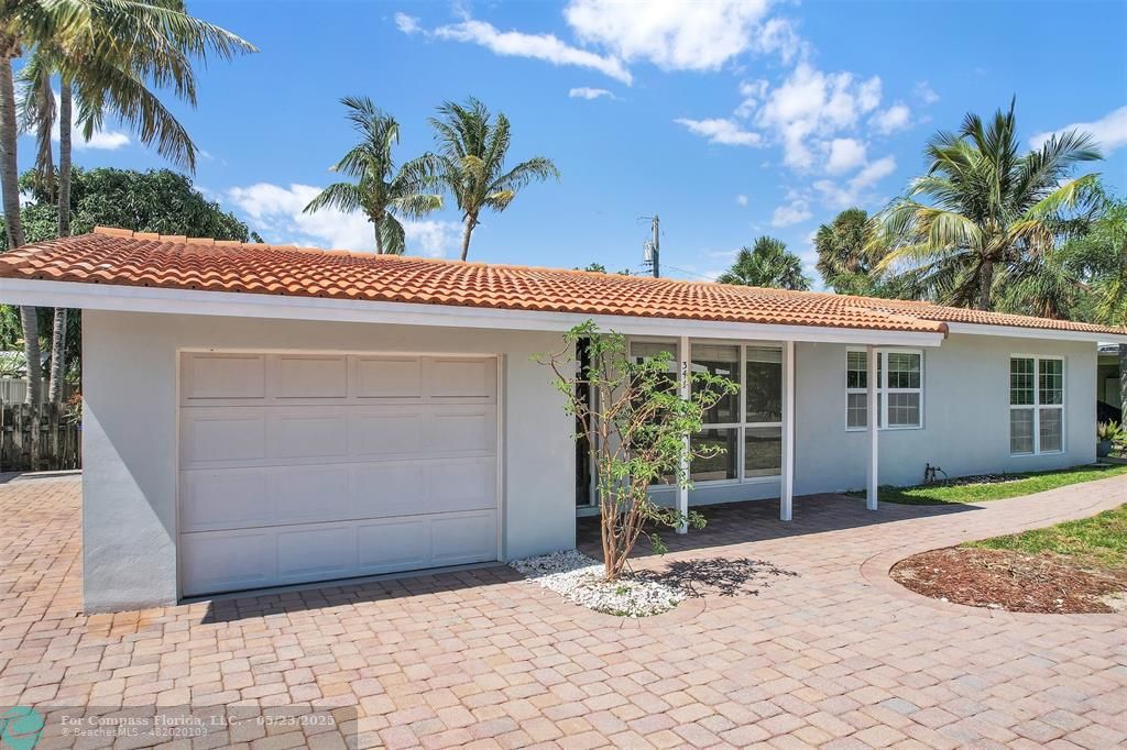 341 Southeast 8th Street Pompano Beach, FL 33060 - Photo 31 of 56 a view of a house with a patio
