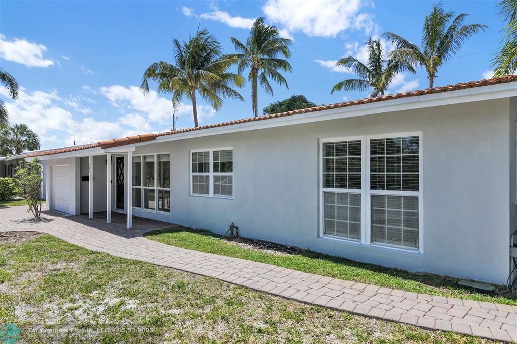 341 Southeast 8th Street Pompano Beach, FL 33060 - Photo 34 of 56 a house with front yard