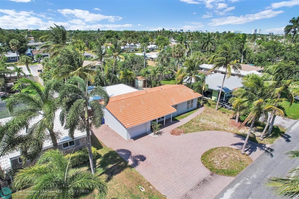 341 Southeast 8th Street Pompano Beach, FL 33060 - Photo 40 of 56 an aerial view of residential houses with outdoor space and trees