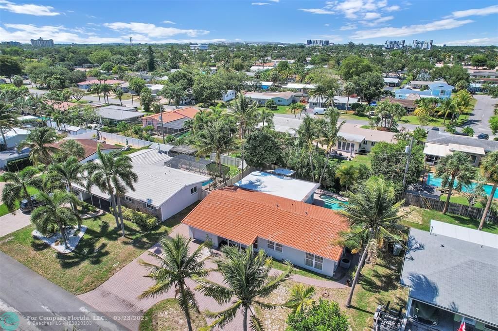 341 Southeast 8th Street Pompano Beach, FL 33060 - Photo 41 of 56 an aerial view of residential houses with outdoor space and trees
