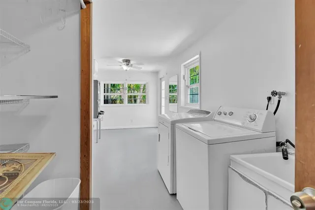 a view of a patio with table and chairs potted plants
