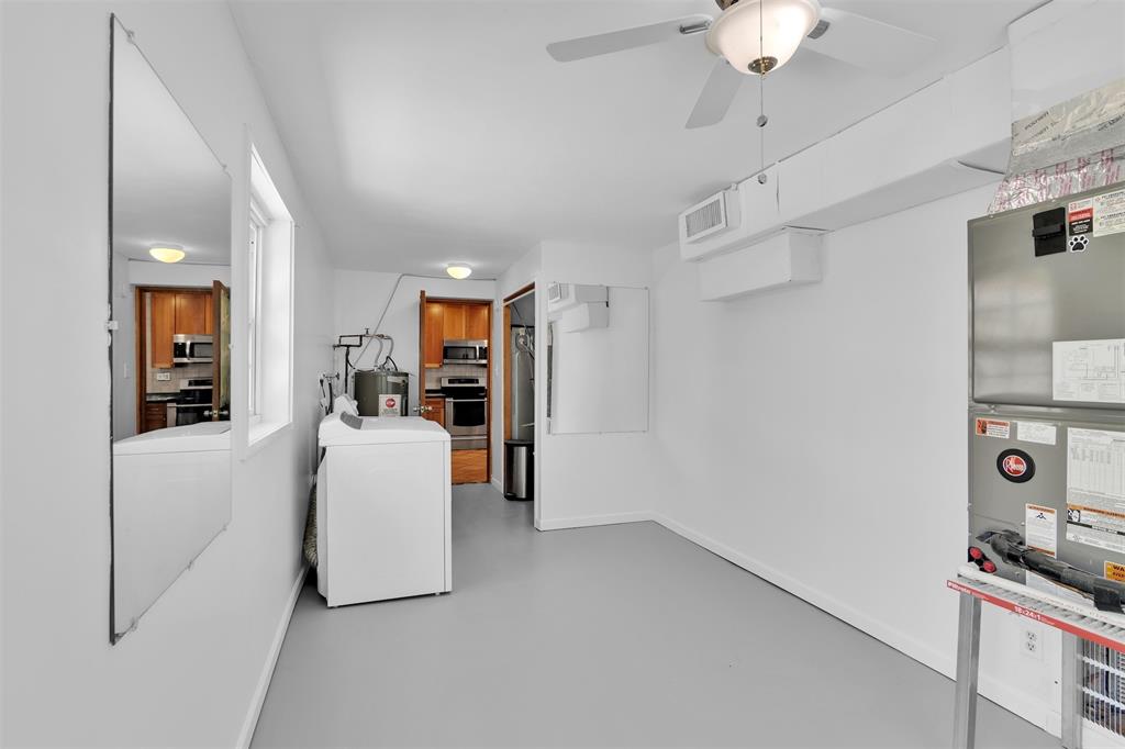 341 Southeast 8th Street Pompano Beach, FL 33060 - Photo 46 of 56 a living room with furniture and a chandelier