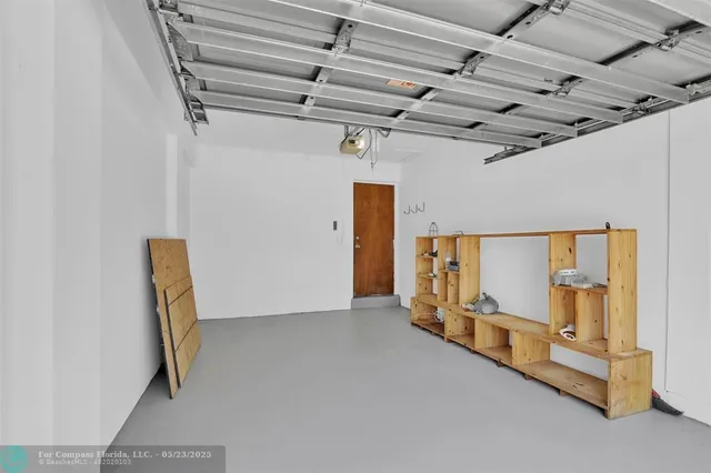 a view of a house with backyard and a tree