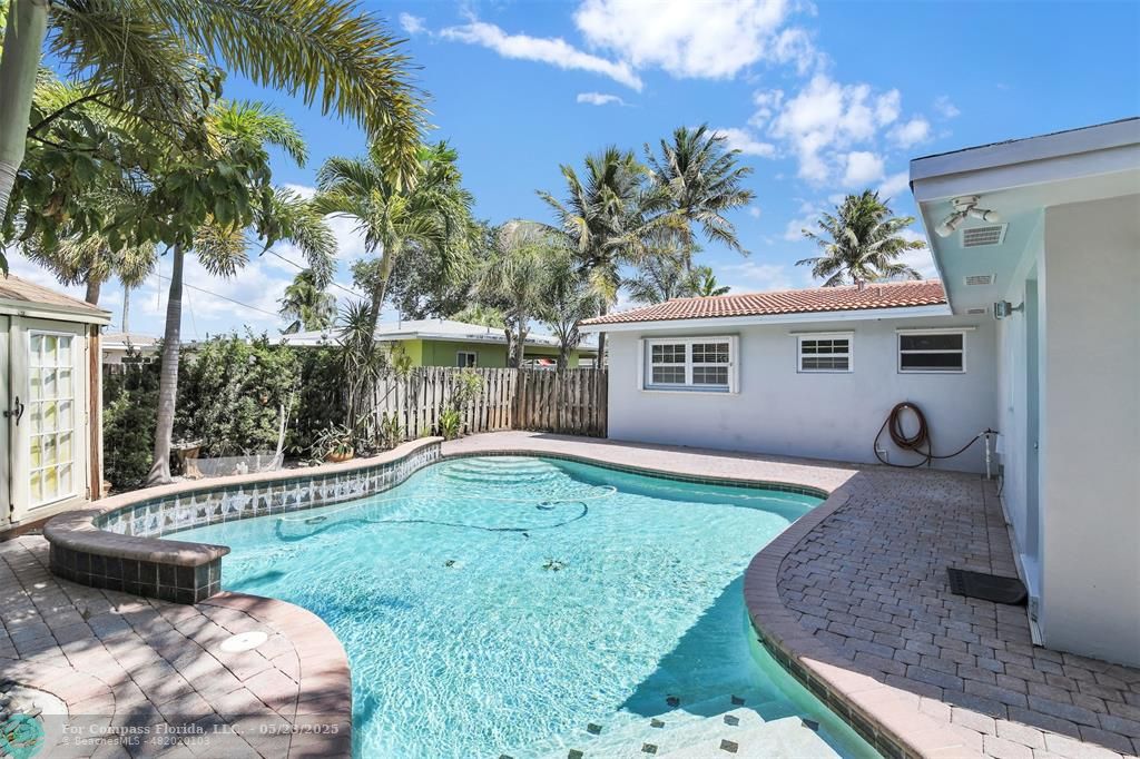 341 Southeast 8th Street Pompano Beach, FL 33060 - Photo 52 of 56 a view of a house with backyard and a tree