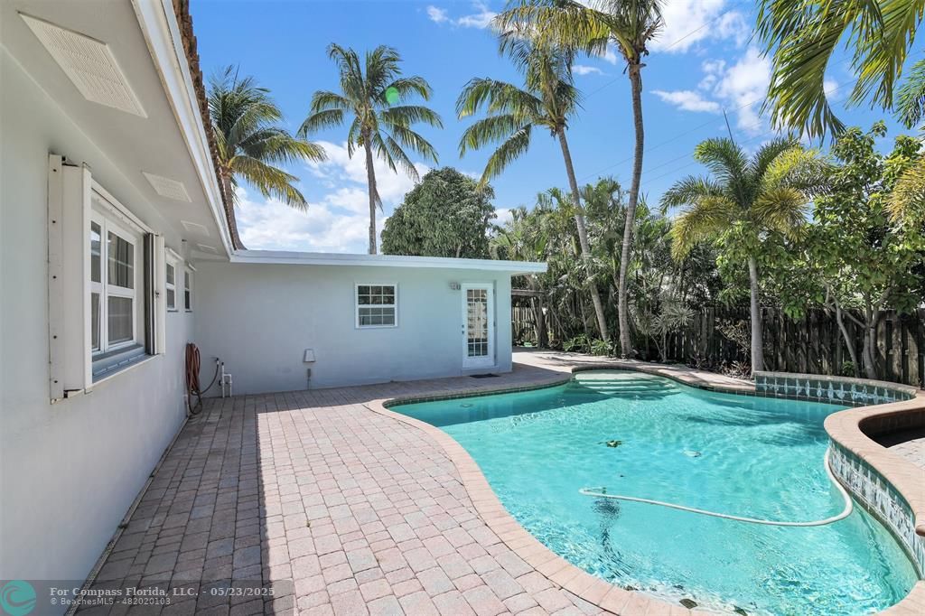 341 Southeast 8th Street Pompano Beach, FL 33060 - Photo 54 of 56 a front view of a house with garden