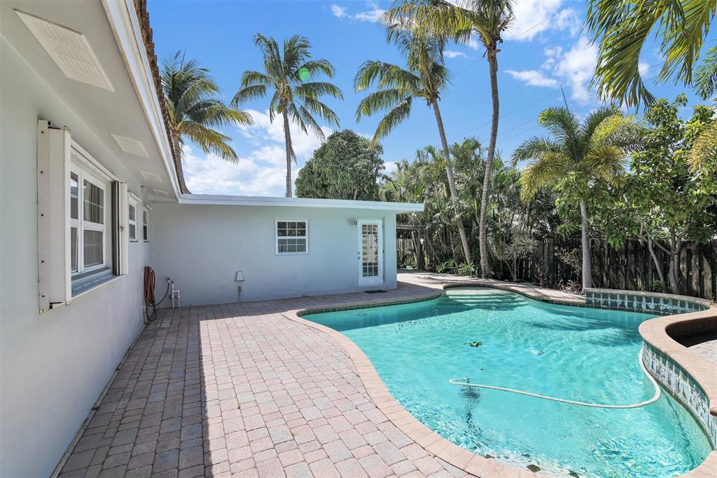 341 Southeast 8th Street Pompano Beach, FL 33060 - Photo 54 of 56 a front view of a house with garden