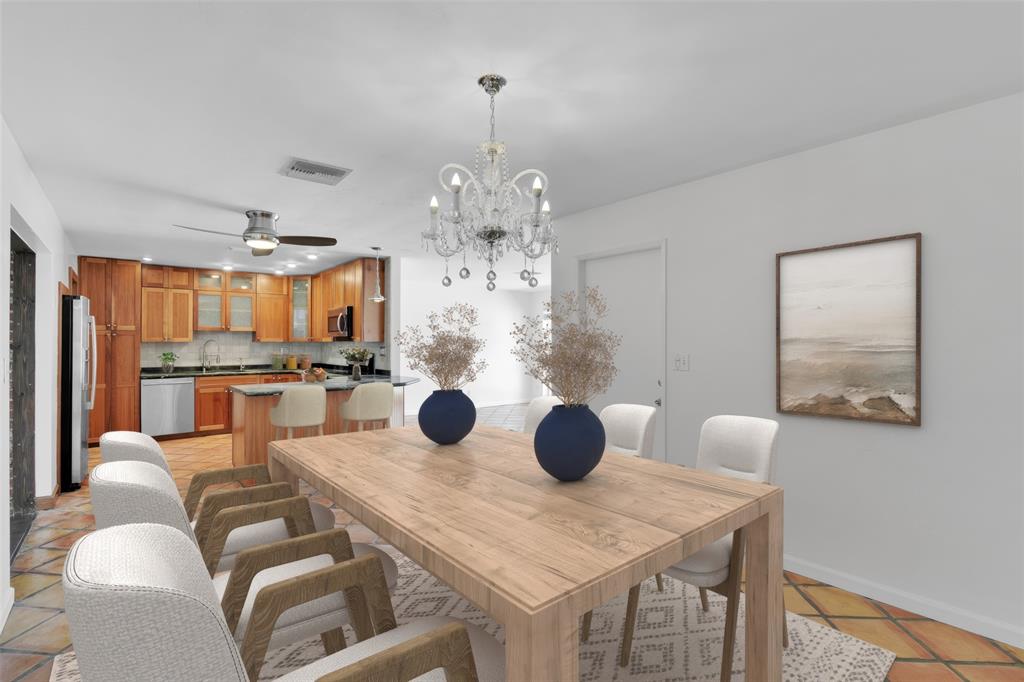 341 Southeast 8th Street Pompano Beach, FL 33060 - Photo 10 of 56 a view of a dining room with furniture and wooden floor