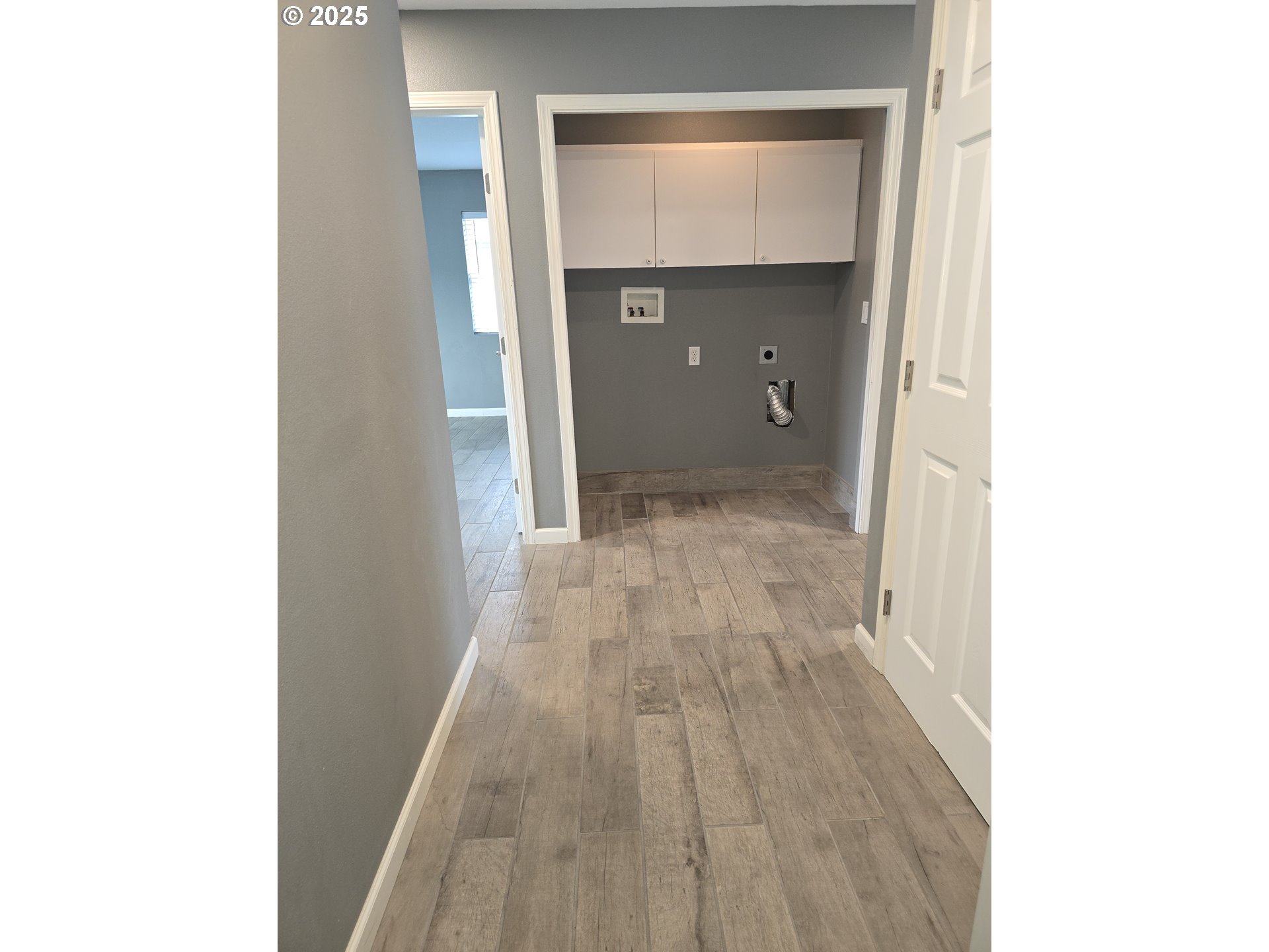 260 Lone Pine Lane, Unit 2 The Dalles, OR 97058 - Photo 16 of 23 a view of a hallway with wooden floor