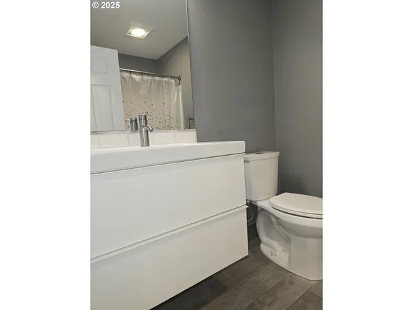 a bathroom with a sink toilet and vanity