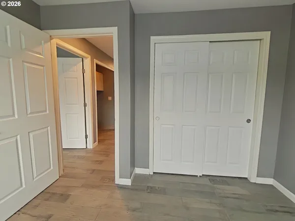 an empty room with wooden floor