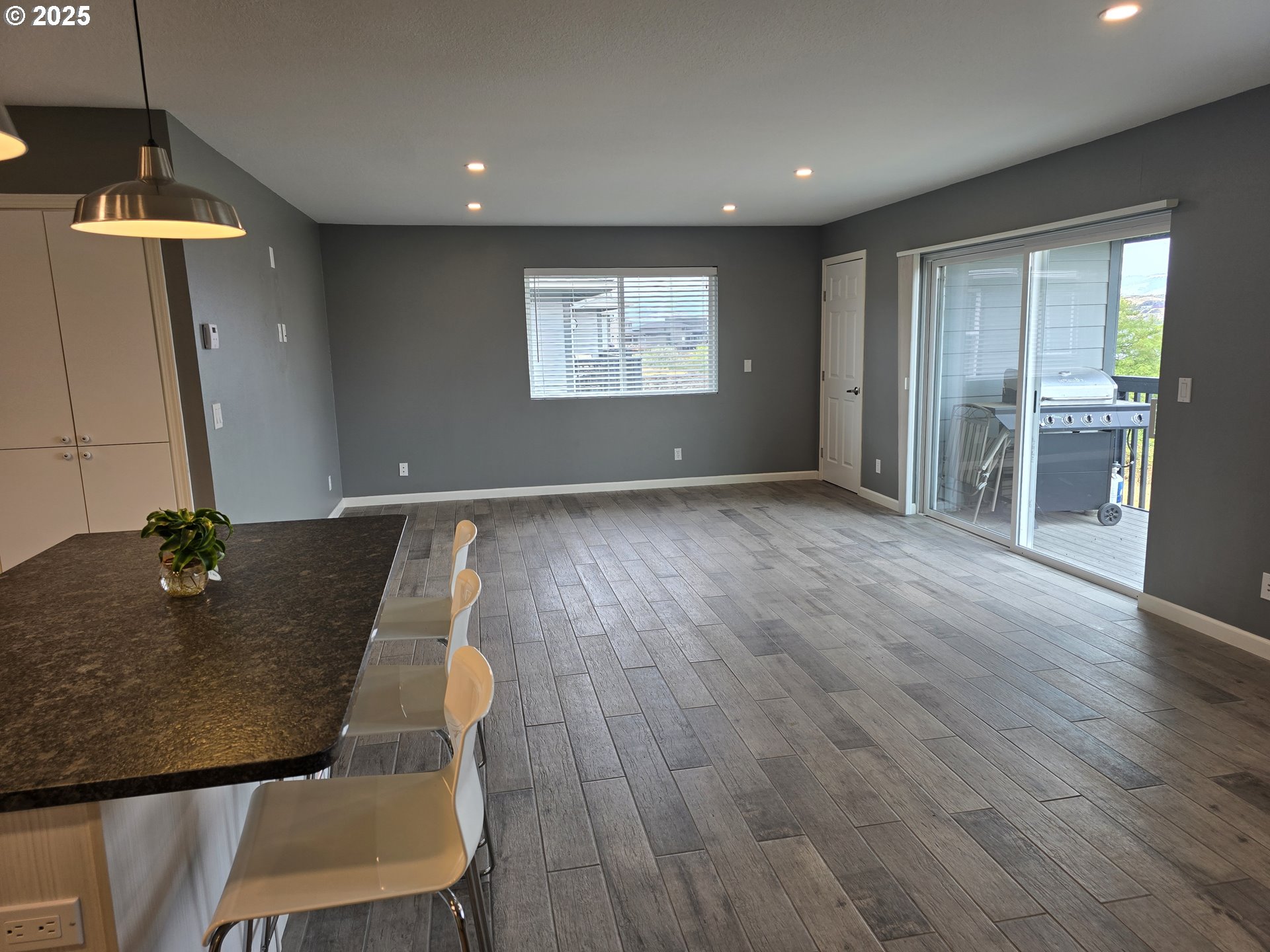 260 Lone Pine Lane, Unit 2 The Dalles, OR 97058 - Photo 5 of 23 a view of a livingroom with furniture wooden floor and window