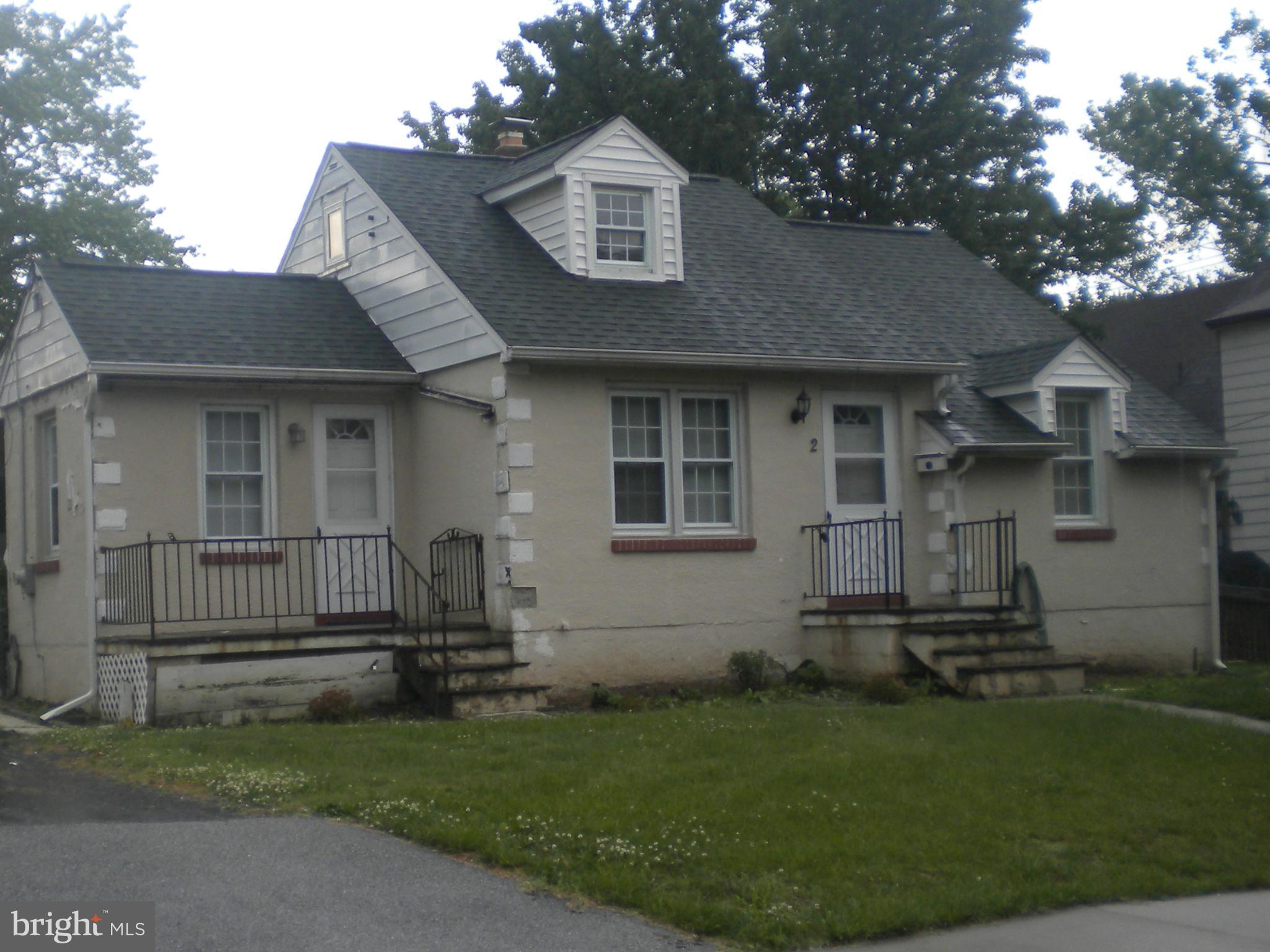 2 Patapsco Road Linthicum Heights, MD 21090 - Photo 1 of 12 a front view of a house with a garden