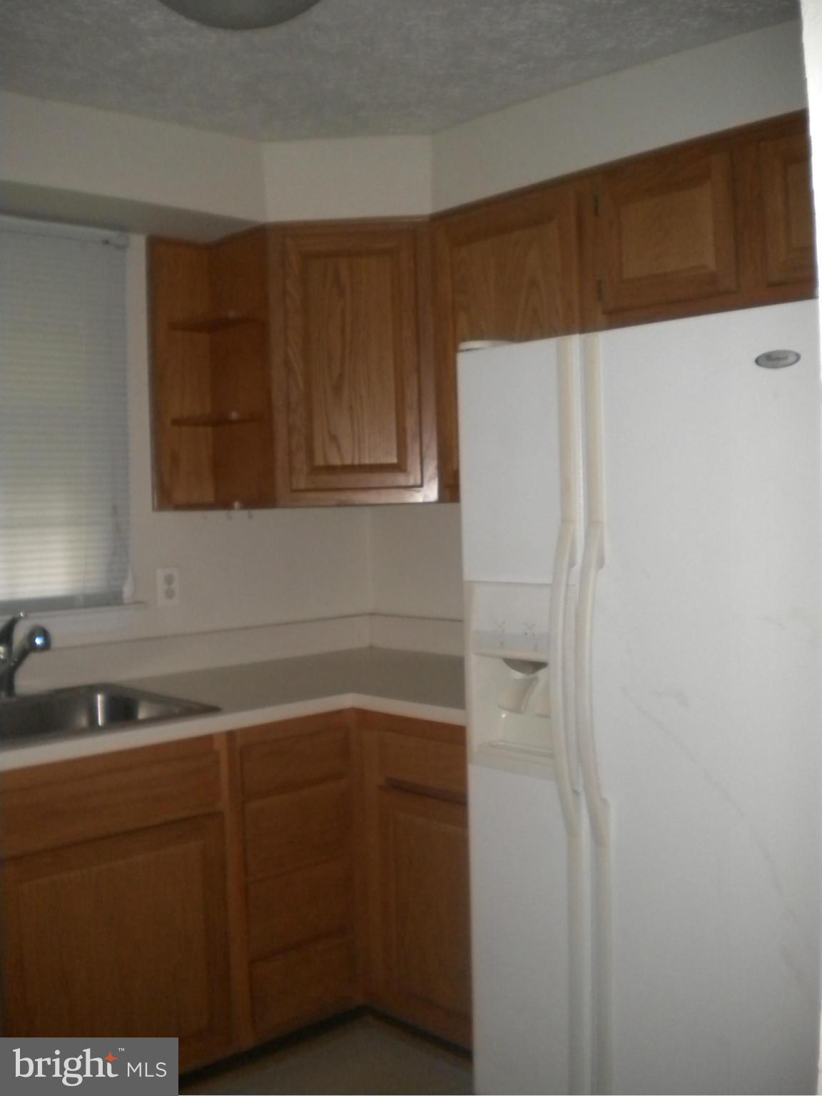 2 Patapsco Road Linthicum Heights, MD 21090 - Photo 3 of 12 a kitchen with a sink and cabinets
