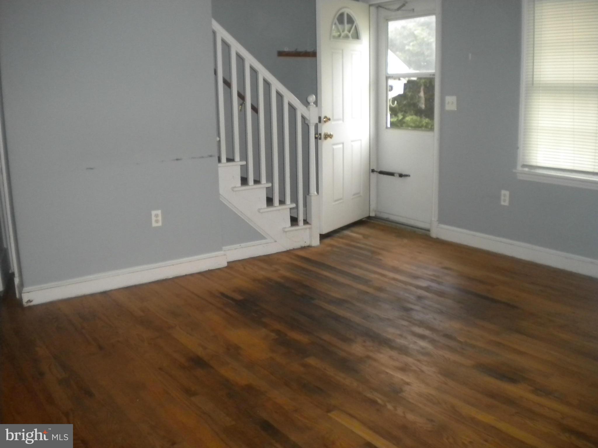 2 Patapsco Road Linthicum Heights, MD 21090 - Photo 5 of 12 a view of a hallway with wooden floor and a window