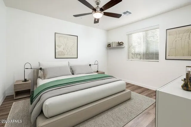 a bedroom with a bed and a window