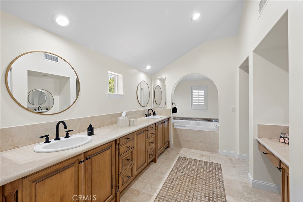 3 Tranquility Place Ladera Ranch, CA 92694 - Photo 27 of 63 a bathroom with a double vanity sink and a mirror